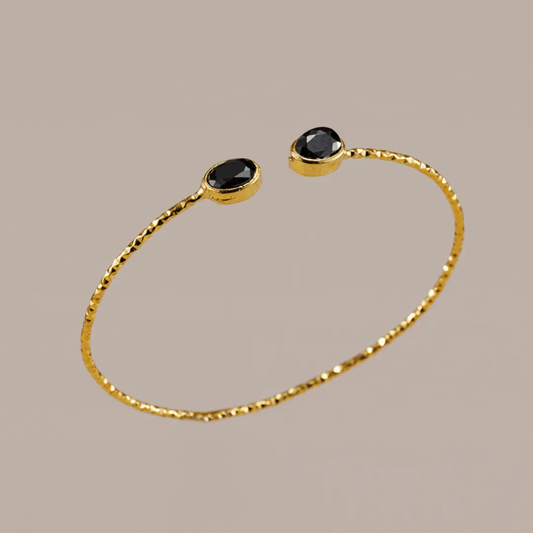 Gif. Brazalete oro y piedra Ra